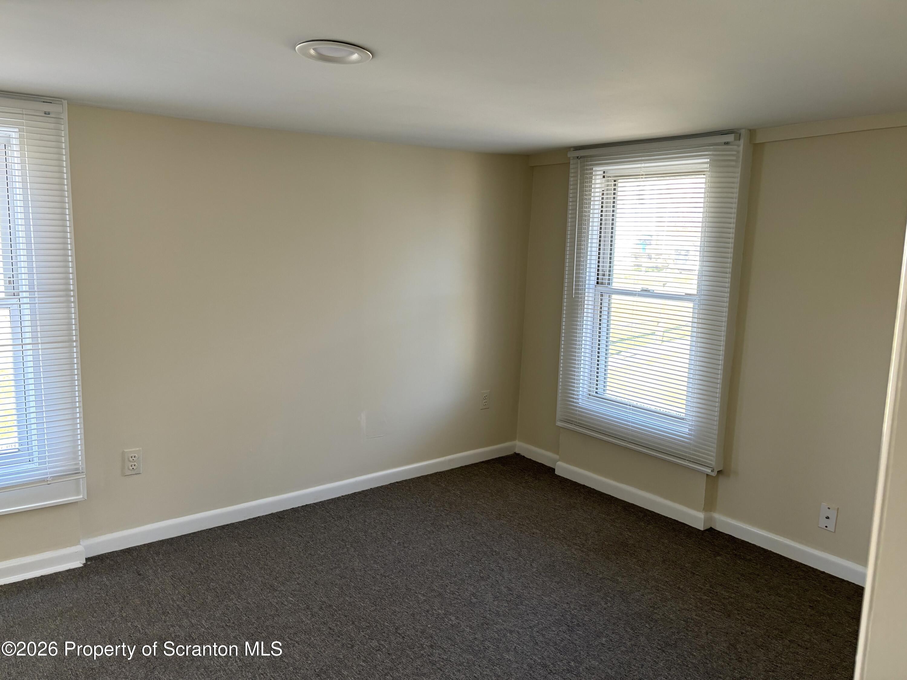 146 6th Street Blakely, PA 18447 - Photo 15 of 24 an empty room with a window
