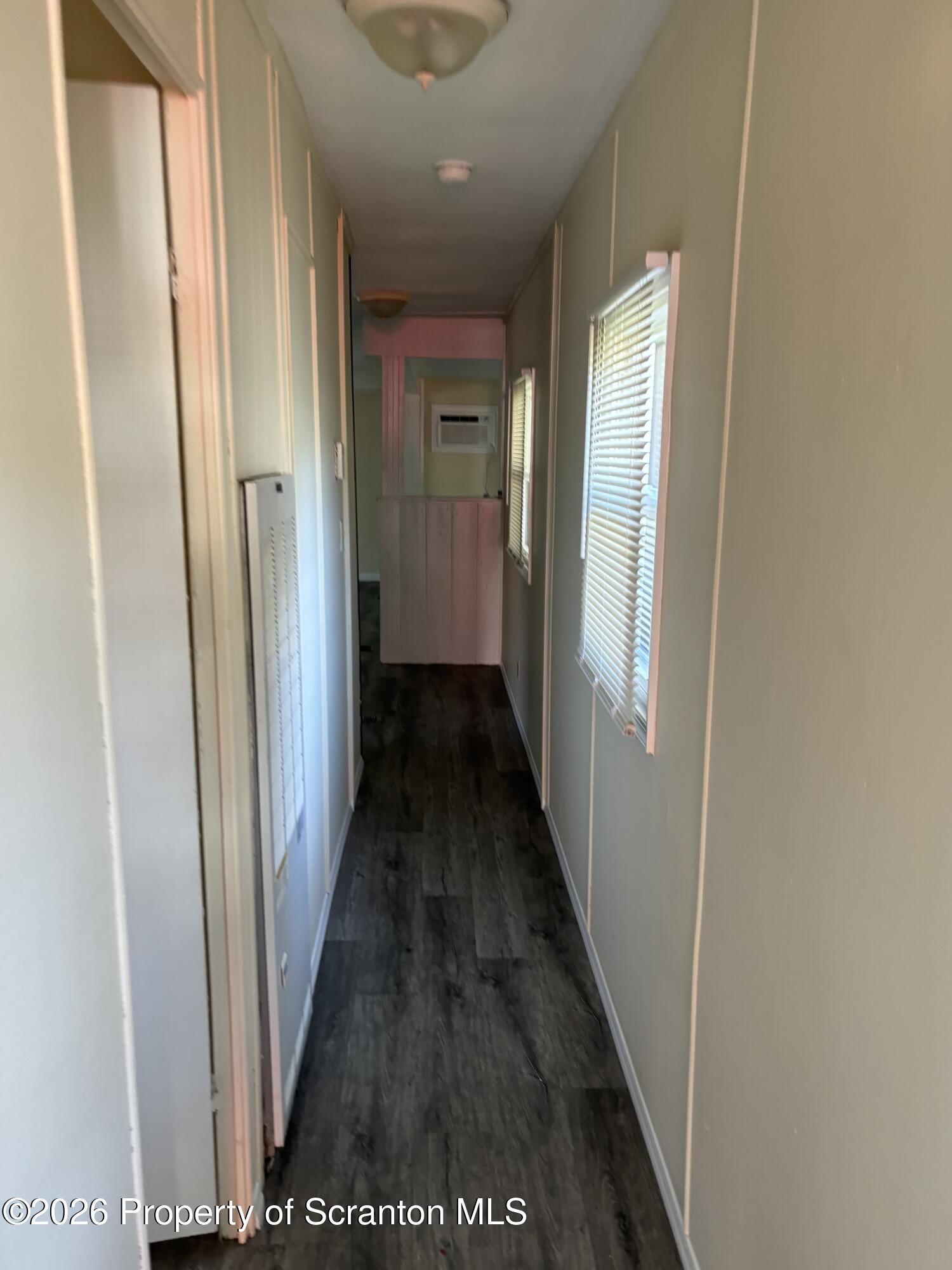 146 6th Street Blakely, PA 18447 - Photo 19 of 24 a view of a hallway with wooden floor and staircase