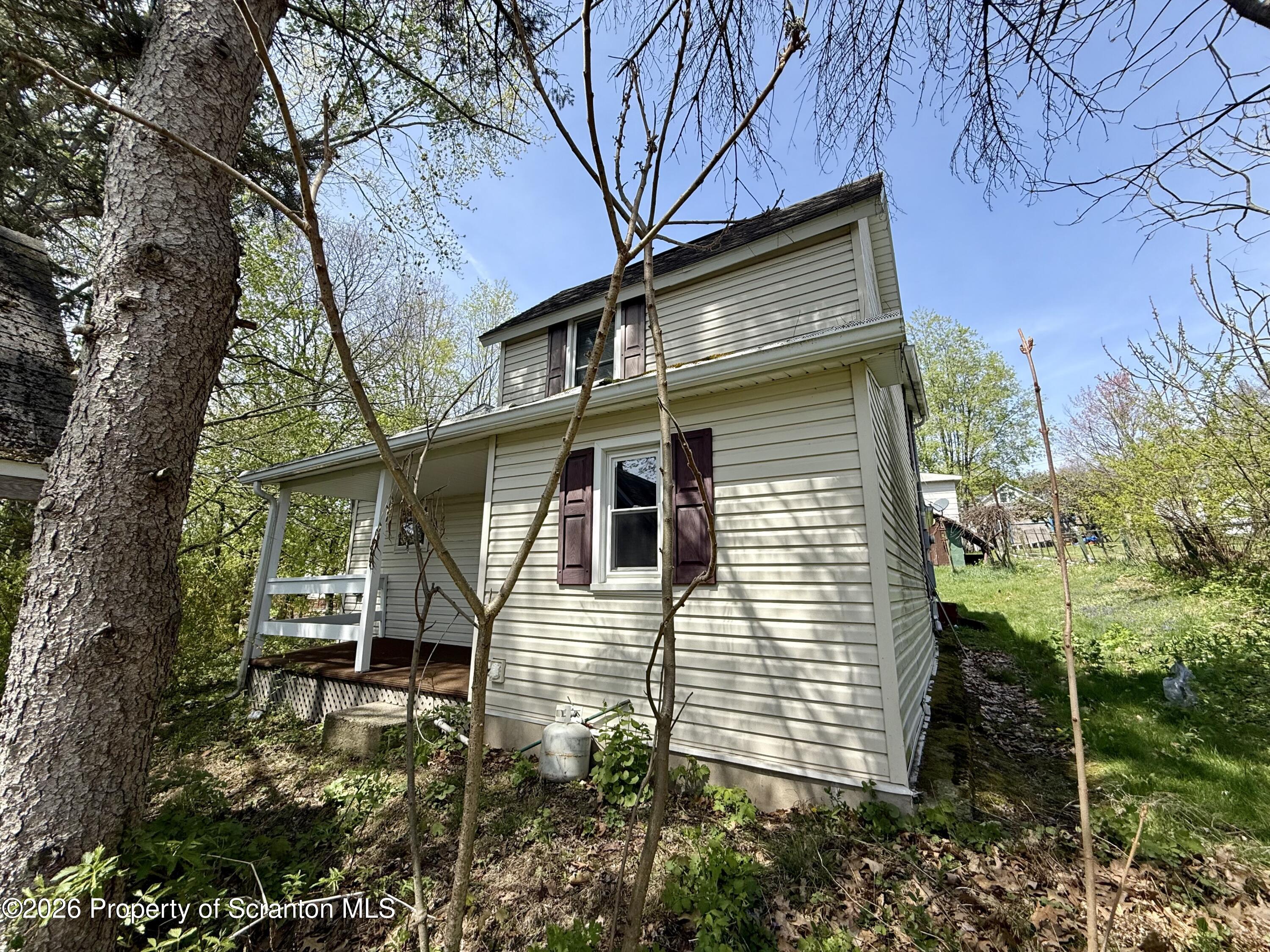 146 6th Street Blakely, PA 18447 - Photo 5 of 24 a front view of a house with garden