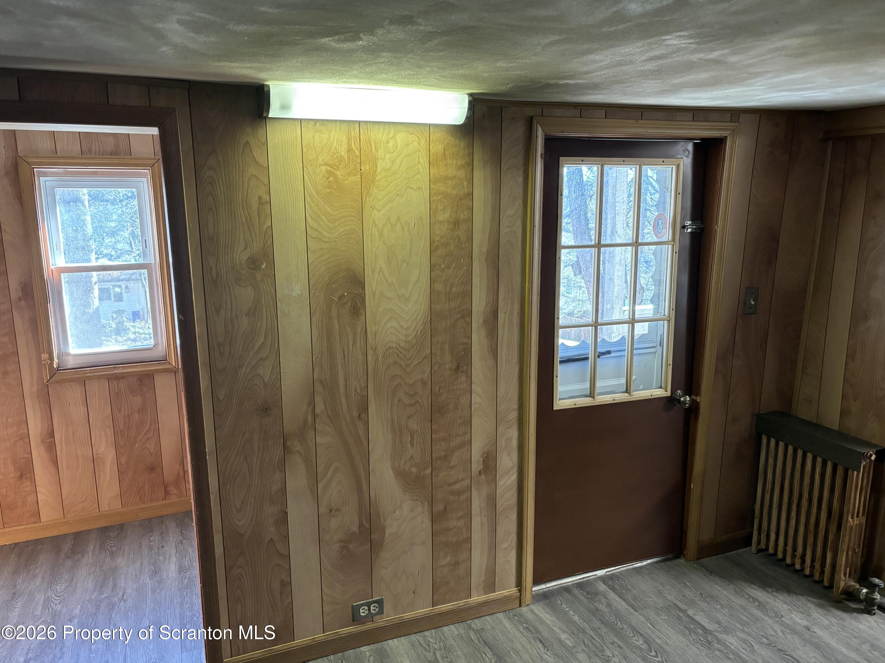 146 6th Street Blakely, PA 18447 - Photo 10 of 24 a view of front door with wooden floor