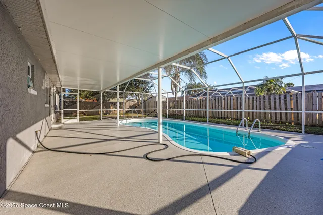 a view of a house with a backyard and stairs