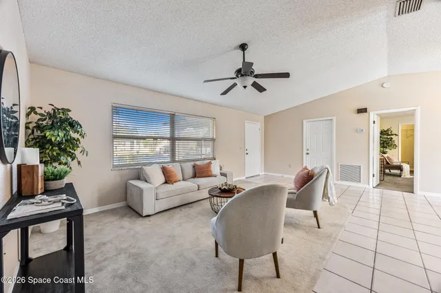a living room with furniture and a window