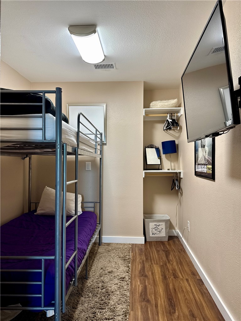 230 Cut-Off Road, Unit B107 Port Aransas, TX 78373 - Photo 13 of 25 a view of a hallway with workspace and window