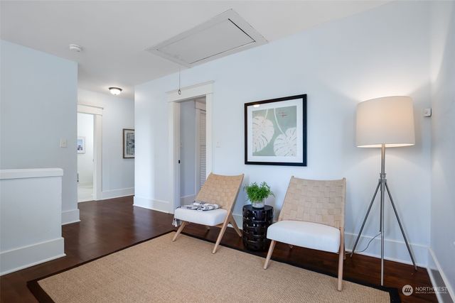 a living room with furniture and a lamp