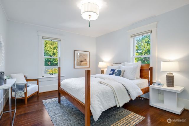 a bedroom with bed and a window