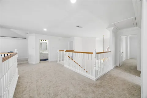 a view of a hallway with white walls