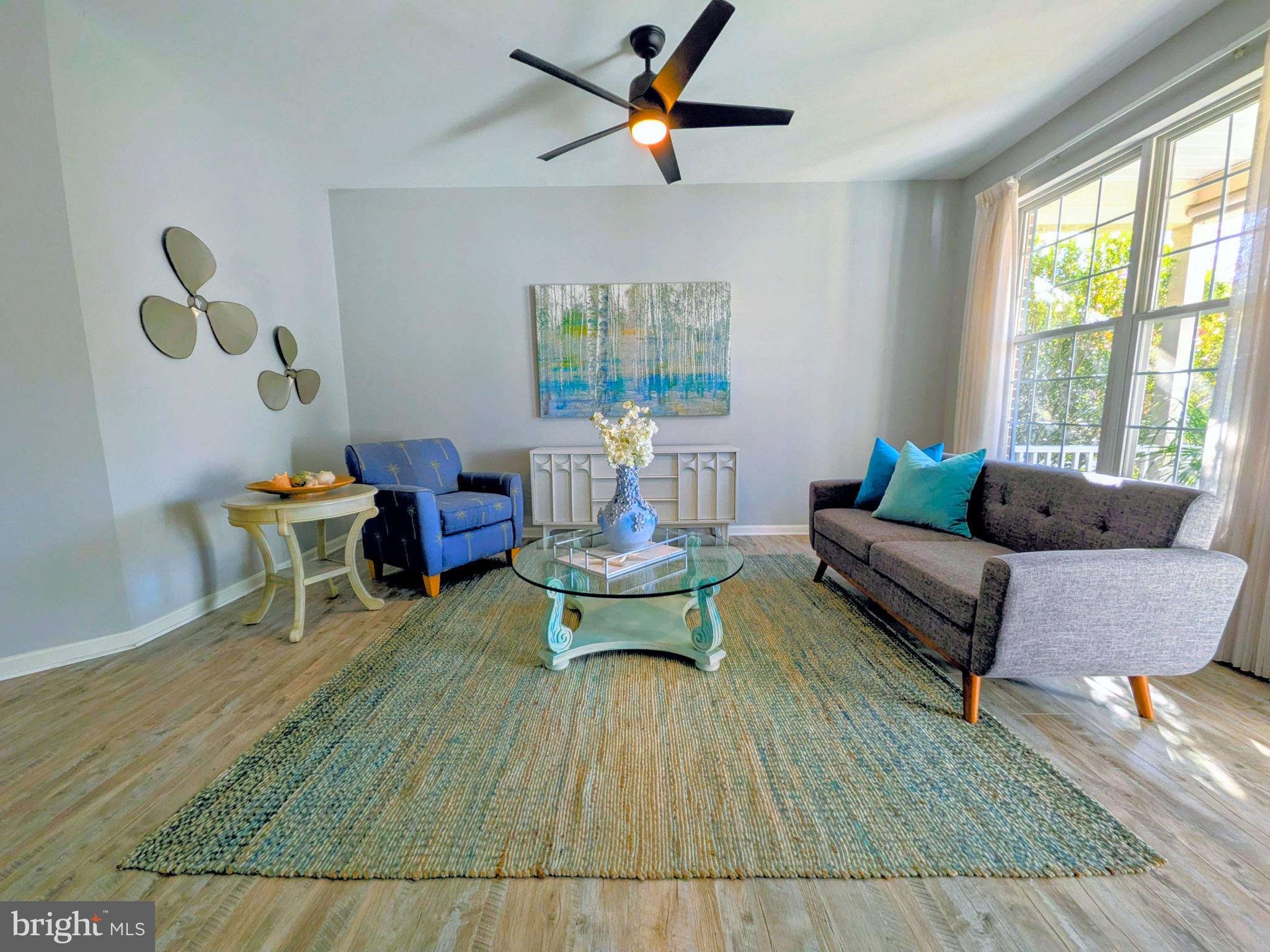 112 Chessie Court Chester, MD 21619 - Photo 14 of 37 a living room with furniture and a large window