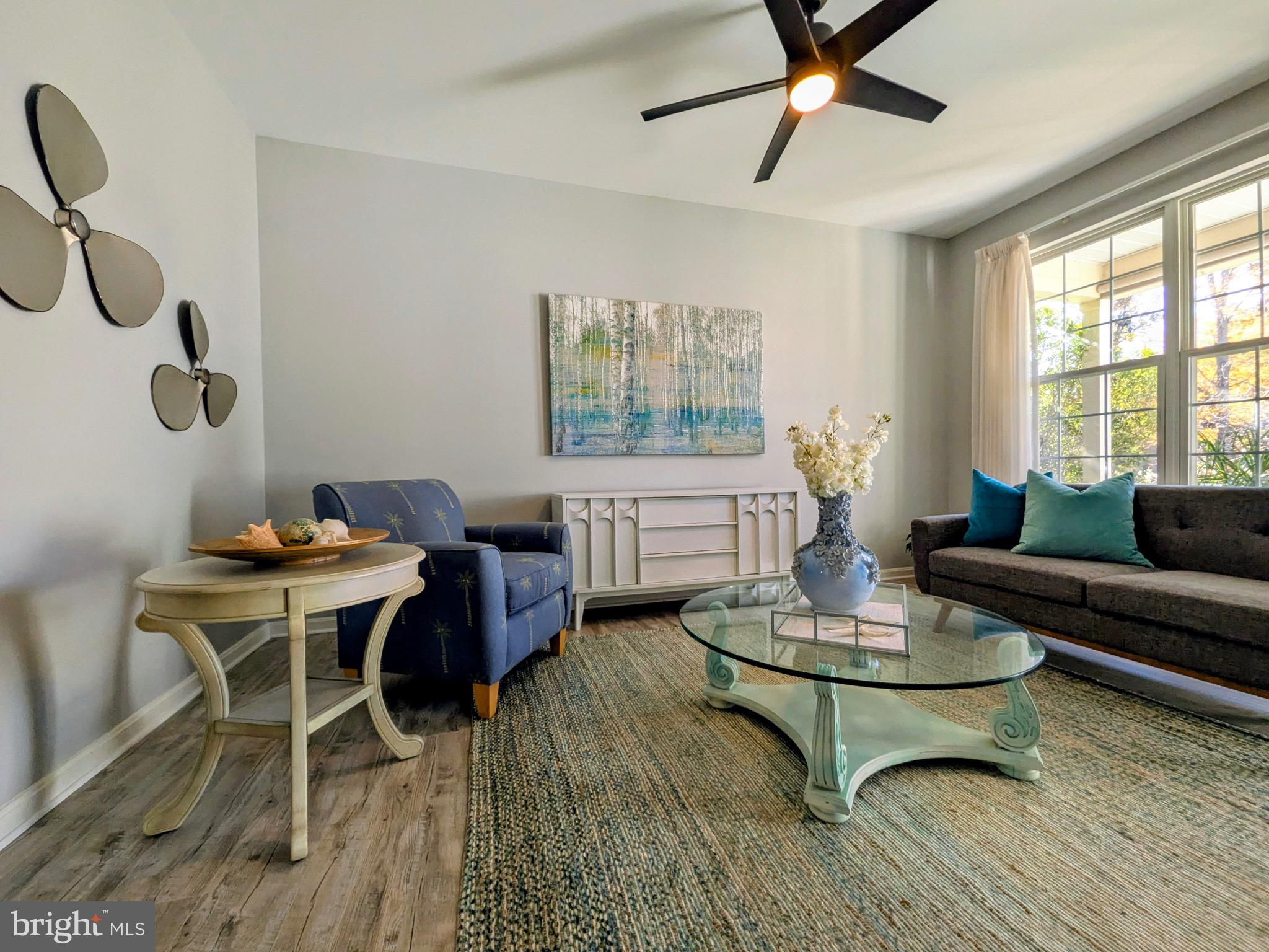 112 Chessie Court Chester, MD 21619 - Photo 16 of 37 a living room with furniture a window and a table