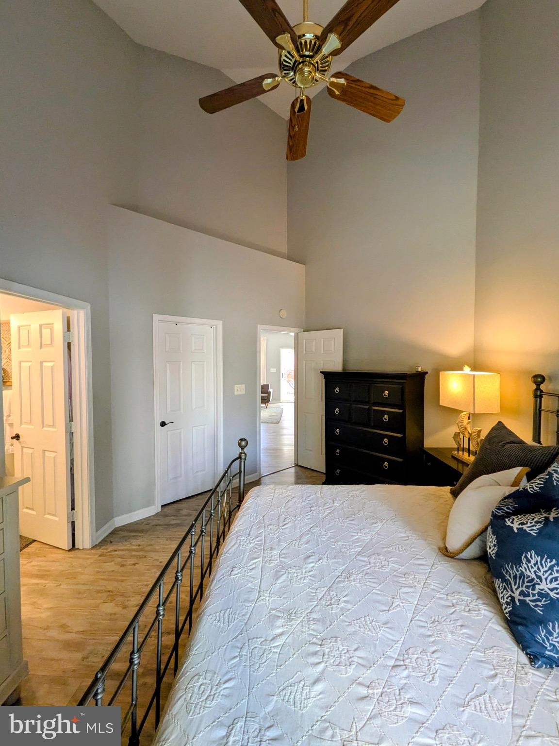 112 Chessie Court Chester, MD 21619 - Photo 18 of 37 a bed room with a bed and a chandelier