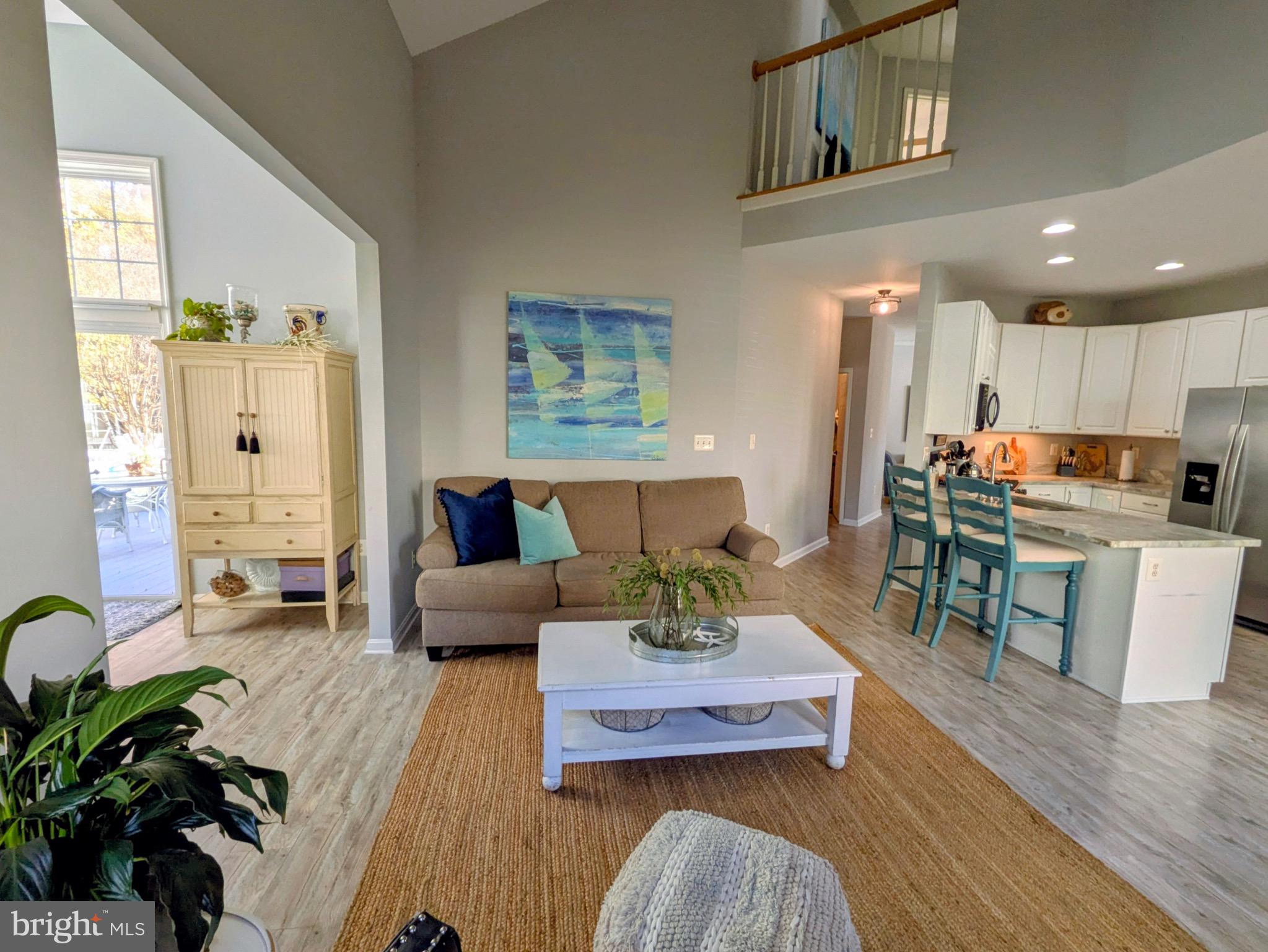 112 Chessie Court Chester, MD 21619 - Photo 2 of 37 a living room with furniture and a wooden floor