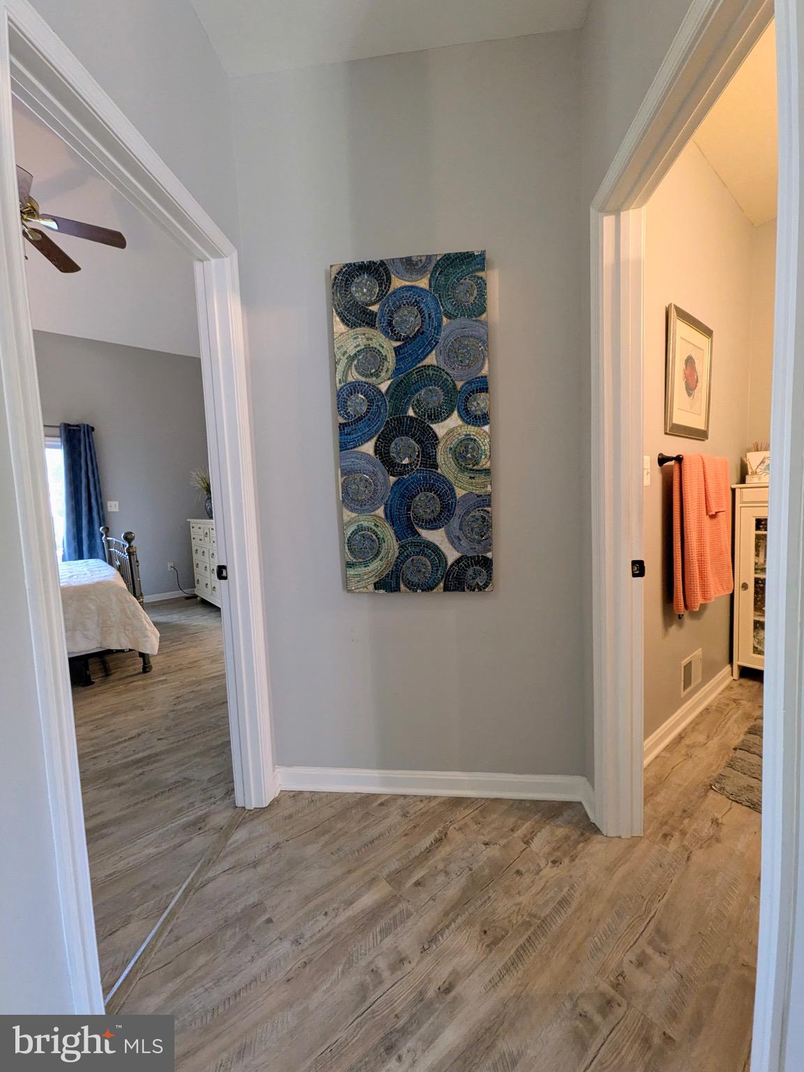 112 Chessie Court Chester, MD 21619 - Photo 21 of 37 a view of a livingroom with wooden floor and a bathroom