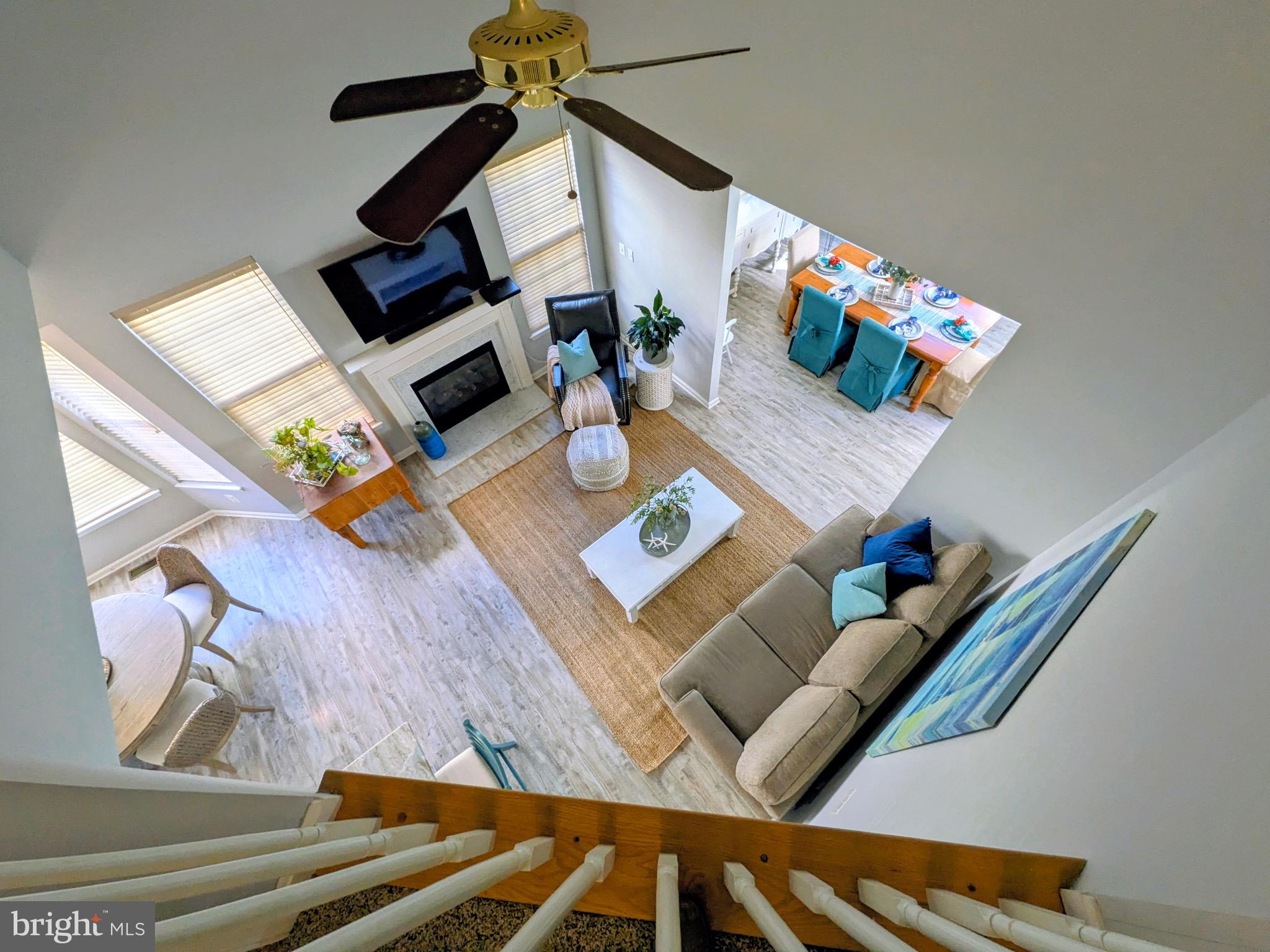 112 Chessie Court Chester, MD 21619 - Photo 22 of 37 a living room with furniture and floor to ceiling windows