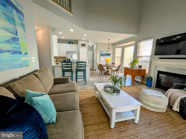 a living room with furniture fireplace and a flat screen tv