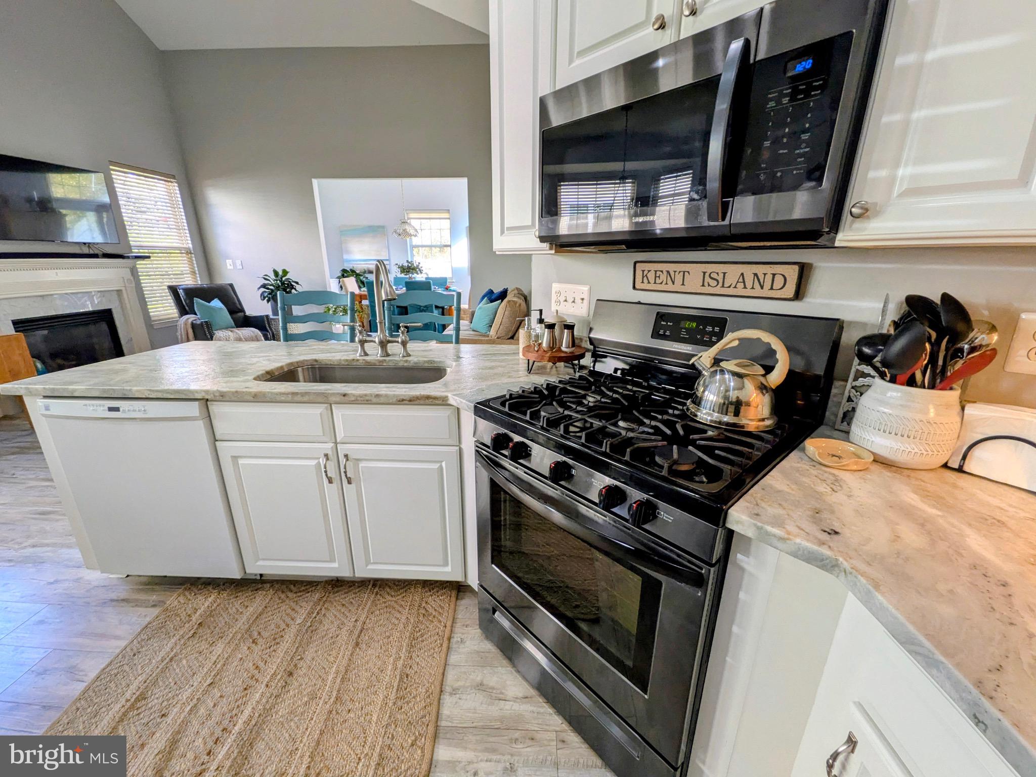 112 Chessie Court Chester, MD 21619 - Photo 5 of 37 a kitchen with a stove and a sink