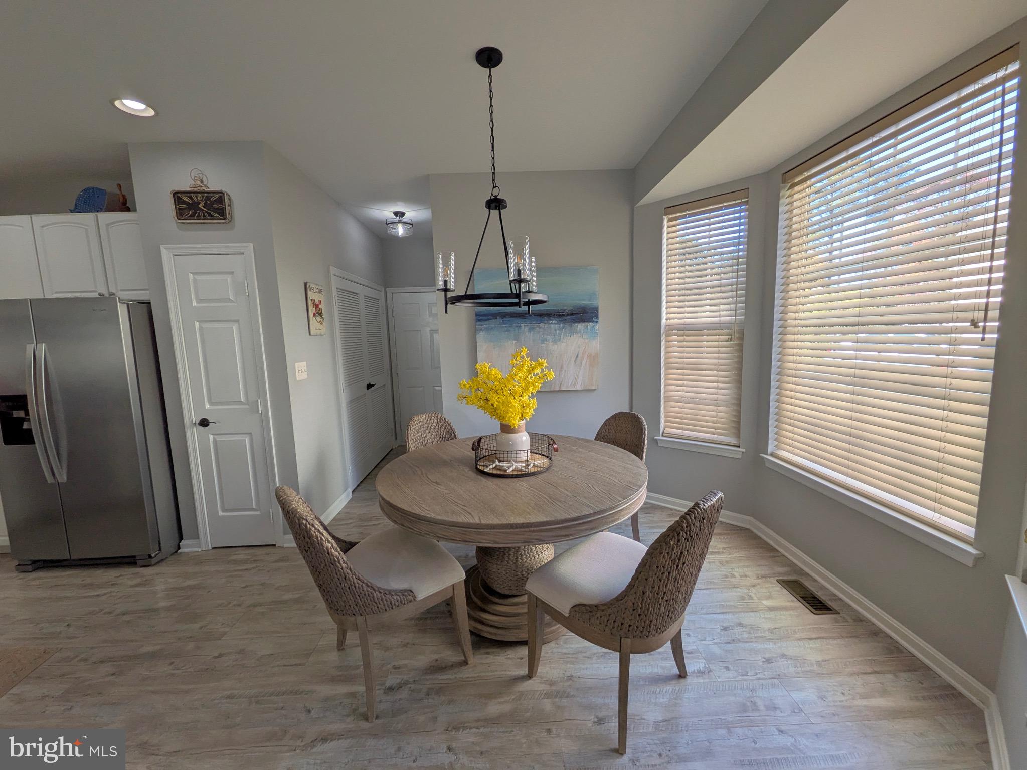 112 Chessie Court Chester, MD 21619 - Photo 10 of 37 a view of a dining room with furniture and a chandelier