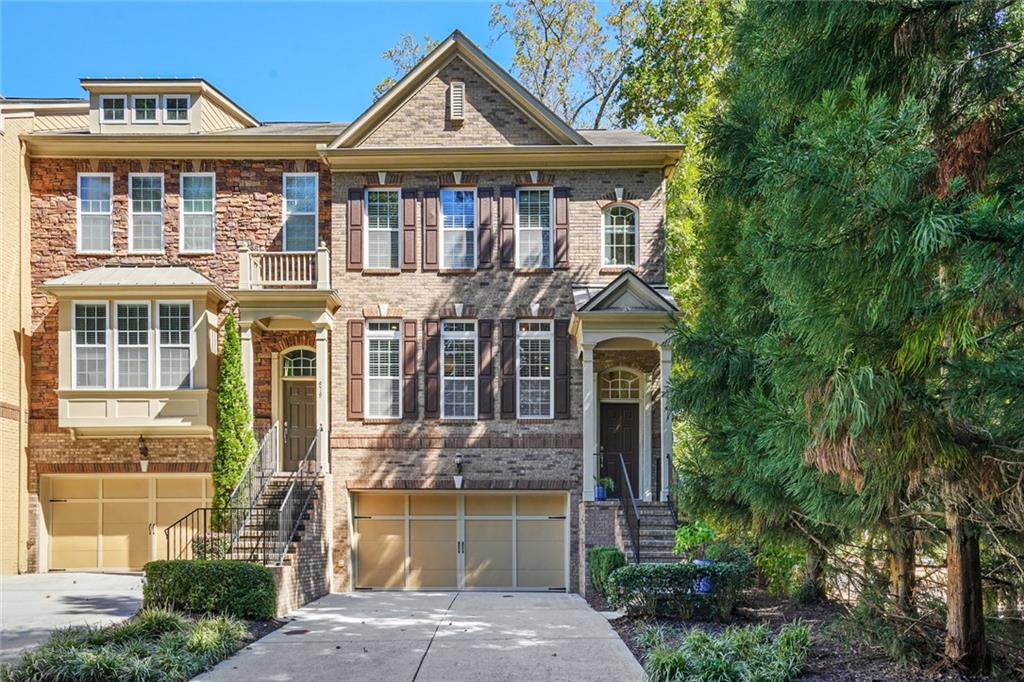 977 Peachmont Court, Unit 49 Decatur, GA 30033 - Photo 1 of 1 a front view of a house with a yard