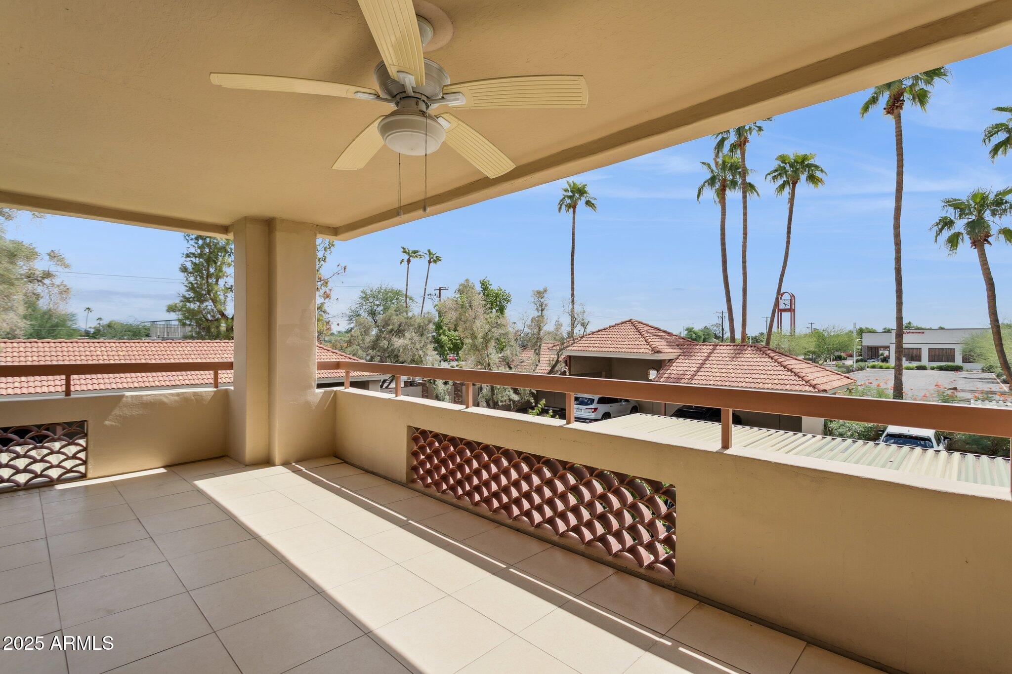 4200 North Miller Road, Unit 220 Scottsdale, AZ 85251 - Photo 19 of 27 a view of a patio with a table and chairs