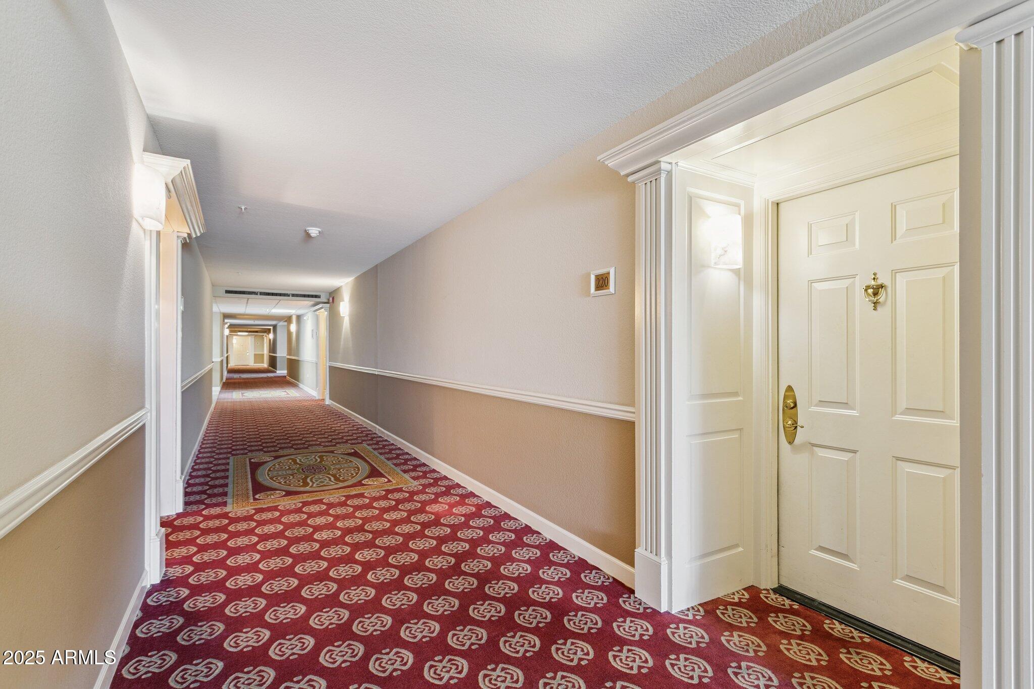 4200 North Miller Road, Unit 220 Scottsdale, AZ 85251 - Photo 26 of 27 a bedroom with a bed and a view of bathroom