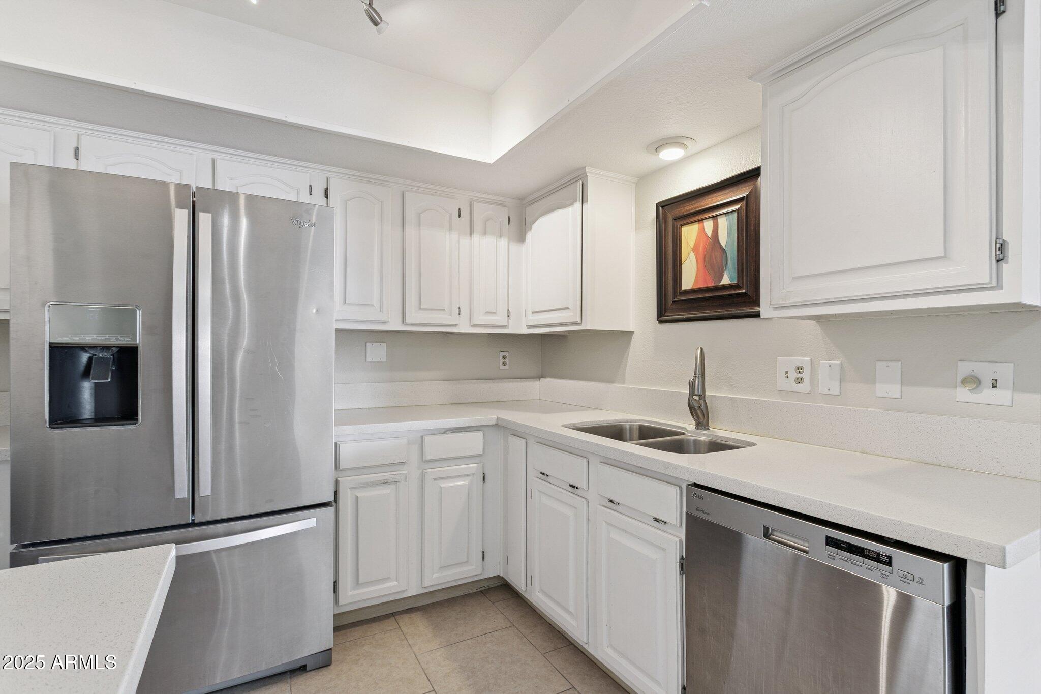 4200 North Miller Road, Unit 220 Scottsdale, AZ 85251 - Photo 3 of 27 a kitchen with appliances cabinets and a sink
