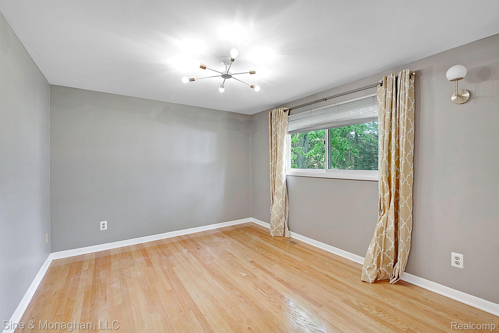 2394 Chalet Drive Rochester, MI 48309 - Photo 23 of 33 Rear bedroom with wood floor