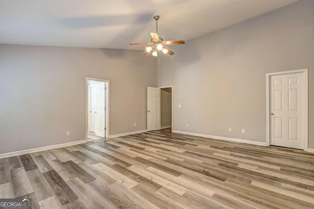 a view of a livingroom with a chandelier fan