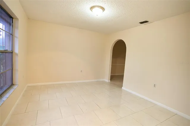 a view of a room has a large window