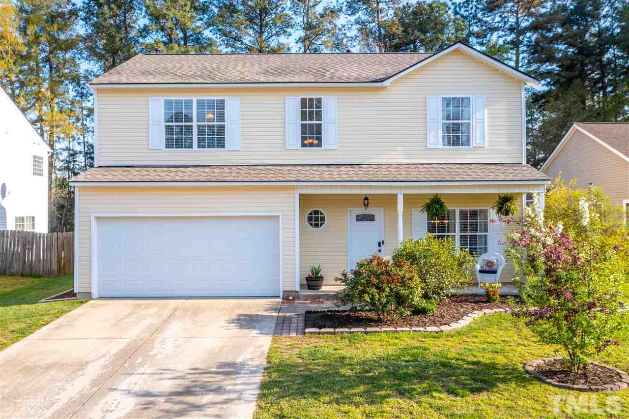 5404 Neuse Forest Road Raleigh, NC 27616 - Photo 1 of 29 a front view of a house with garden