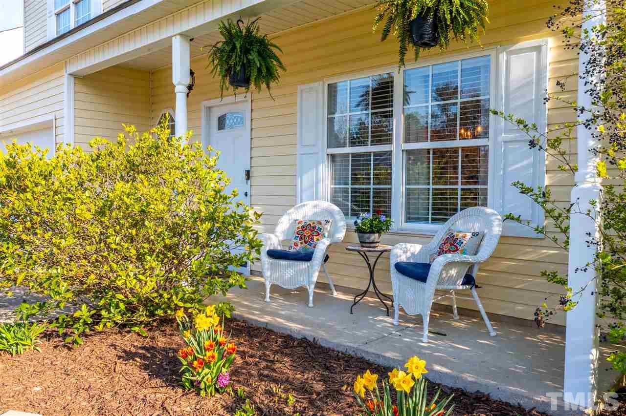 5404 Neuse Forest Road Raleigh, NC 27616 - Photo 3 of 29 a view of a chairs and table in backyard of the house