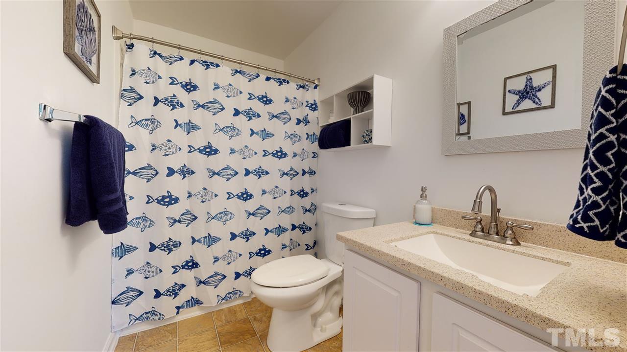 5404 Neuse Forest Road Raleigh, NC 27616 - Photo 24 of 29 a bathroom with a sink toilet and shower