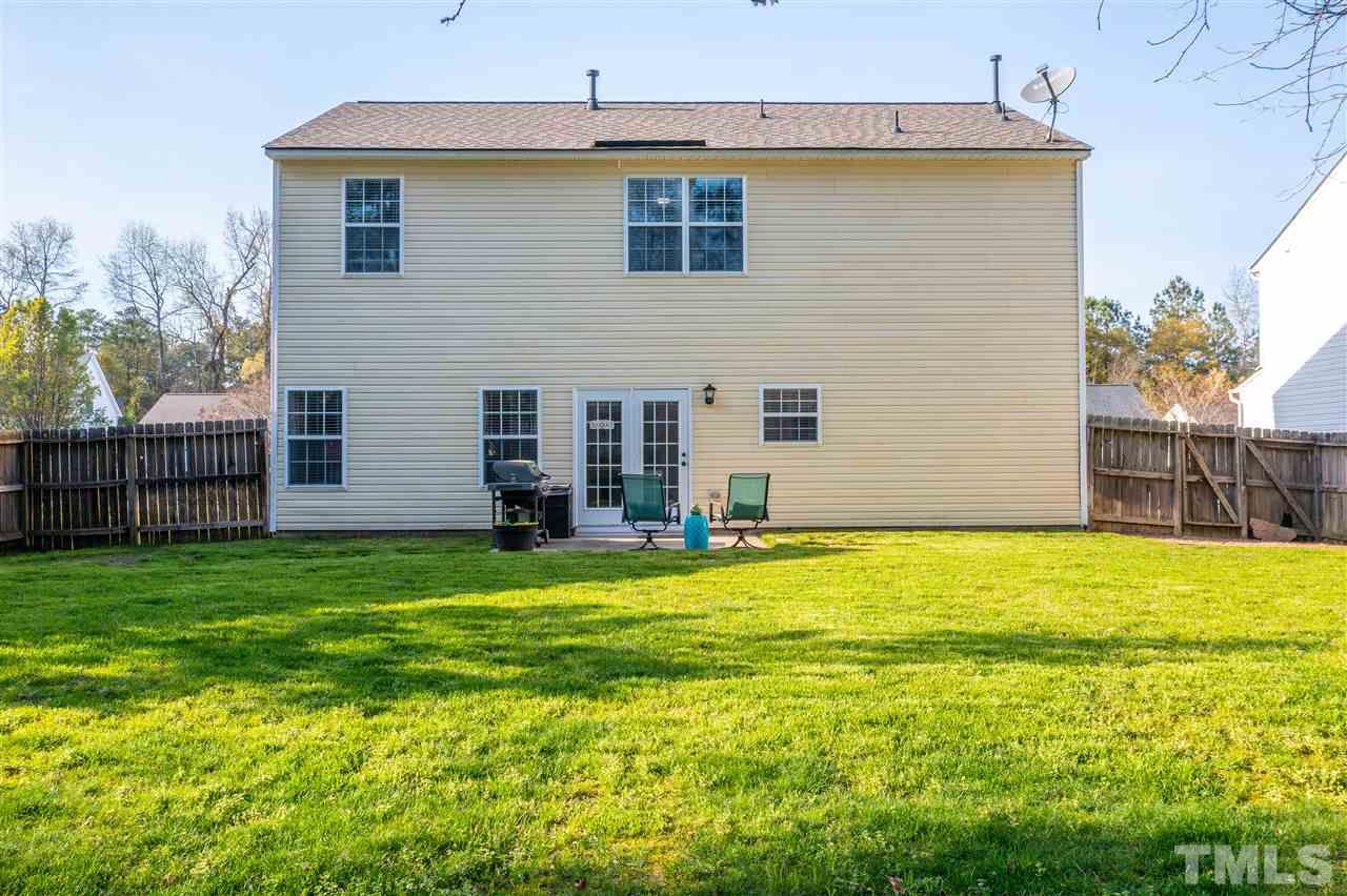 5404 Neuse Forest Road Raleigh, NC 27616 - Photo 25 of 29 a view of a house with a backyard