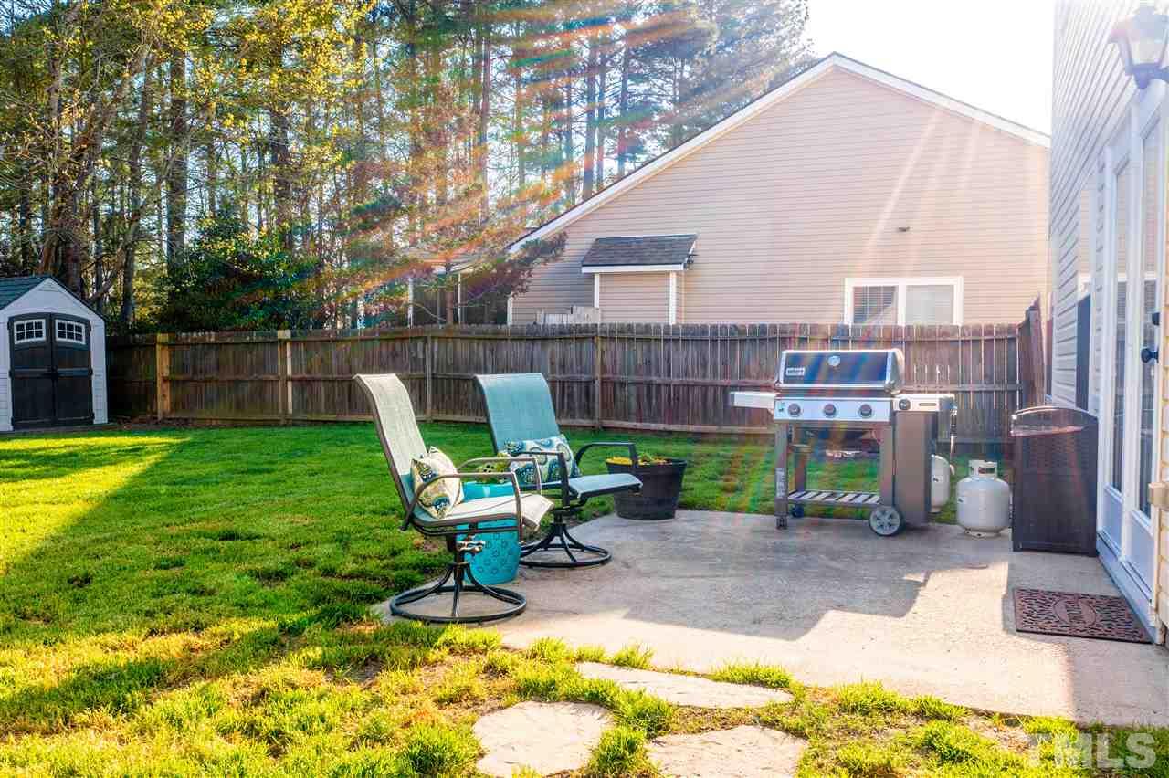 5404 Neuse Forest Road Raleigh, NC 27616 - Photo 27 of 29 a view of a backyard with a table and chairs