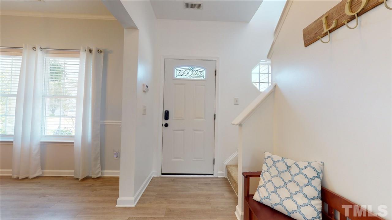5404 Neuse Forest Road Raleigh, NC 27616 - Photo 5 of 29 a view of an entryway with wooden floor