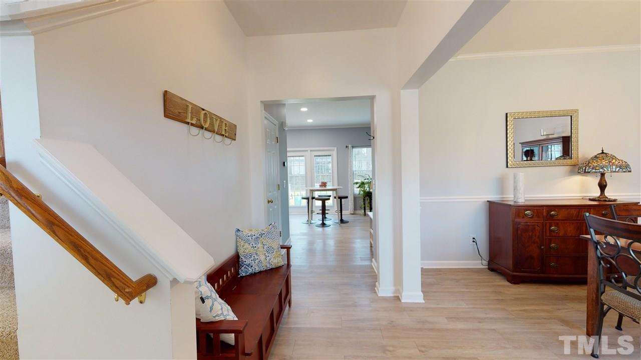 5404 Neuse Forest Road Raleigh, NC 27616 - Photo 6 of 29 a workspace with furniture and wooden floor