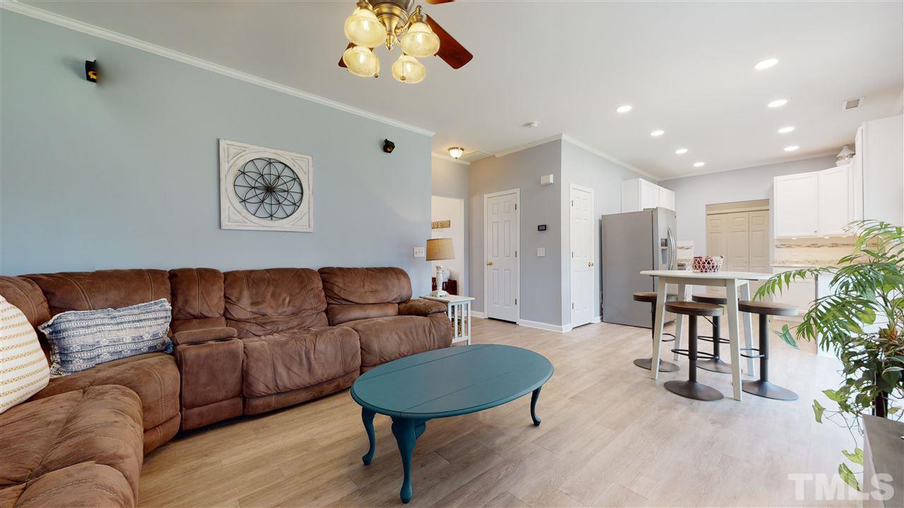 5404 Neuse Forest Road Raleigh, NC 27616 - Photo 10 of 29 a living room with furniture and a wooden floor