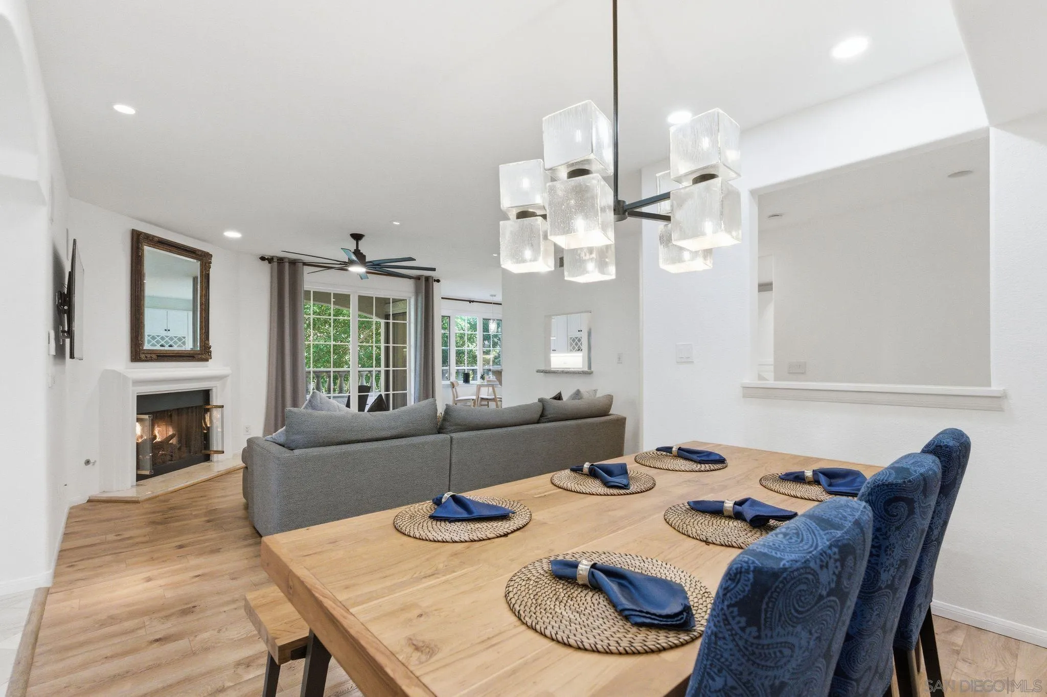 2842 Torrey Pines Road La Jolla, CA 92037 - Photo 11 of 45 a view of a dining room with furniture a chandelier and wooden floor