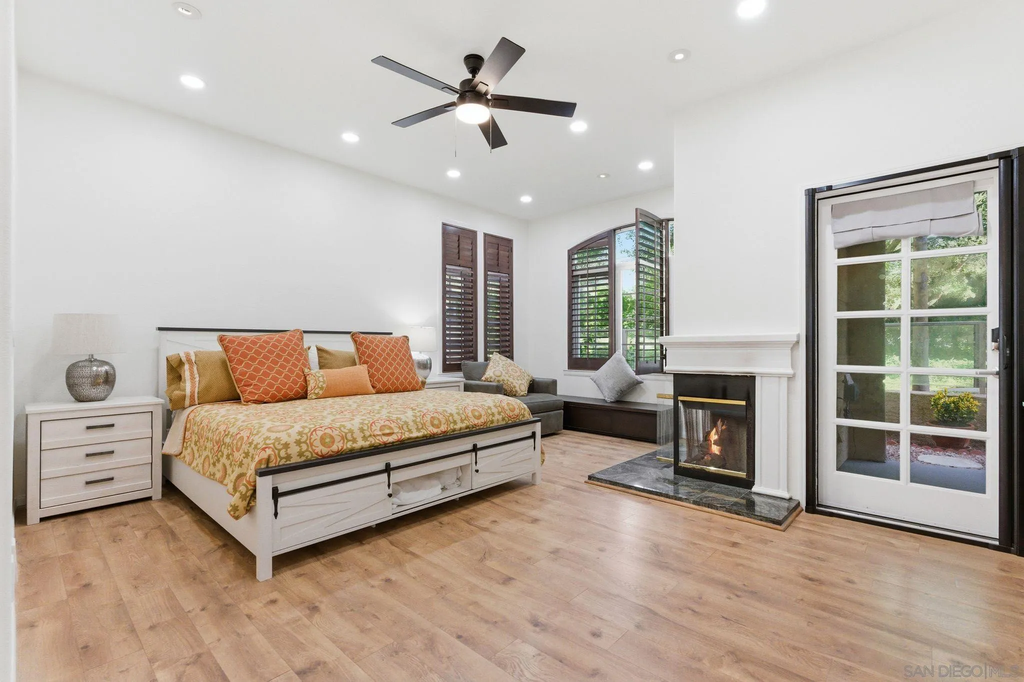 2842 Torrey Pines Road La Jolla, CA 92037 - Photo 29 of 45 a spacious bedroom with a bed and a fireplace