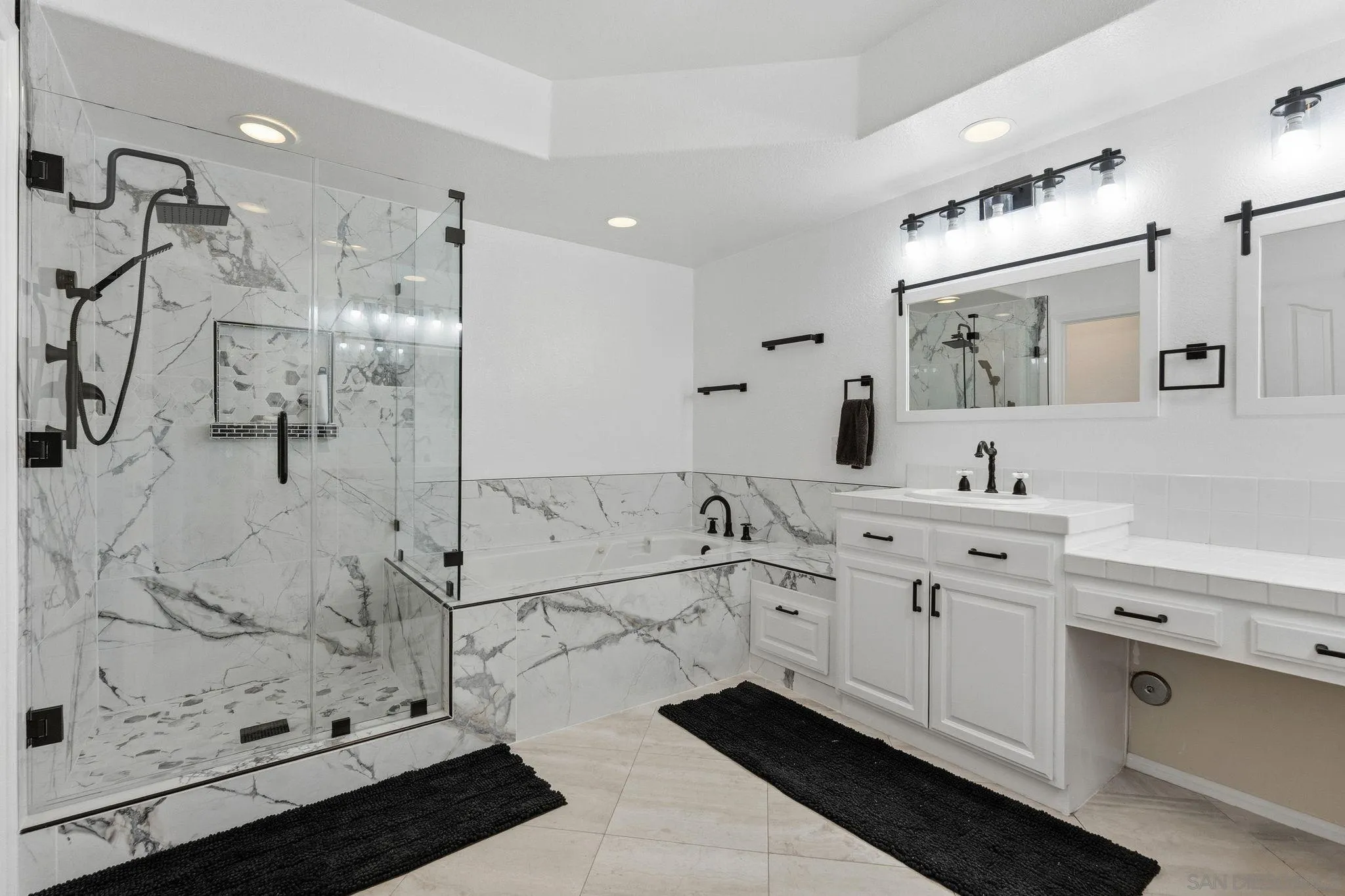 2842 Torrey Pines Road La Jolla, CA 92037 - Photo 37 of 45 a spacious bathroom with shower sink and mirror