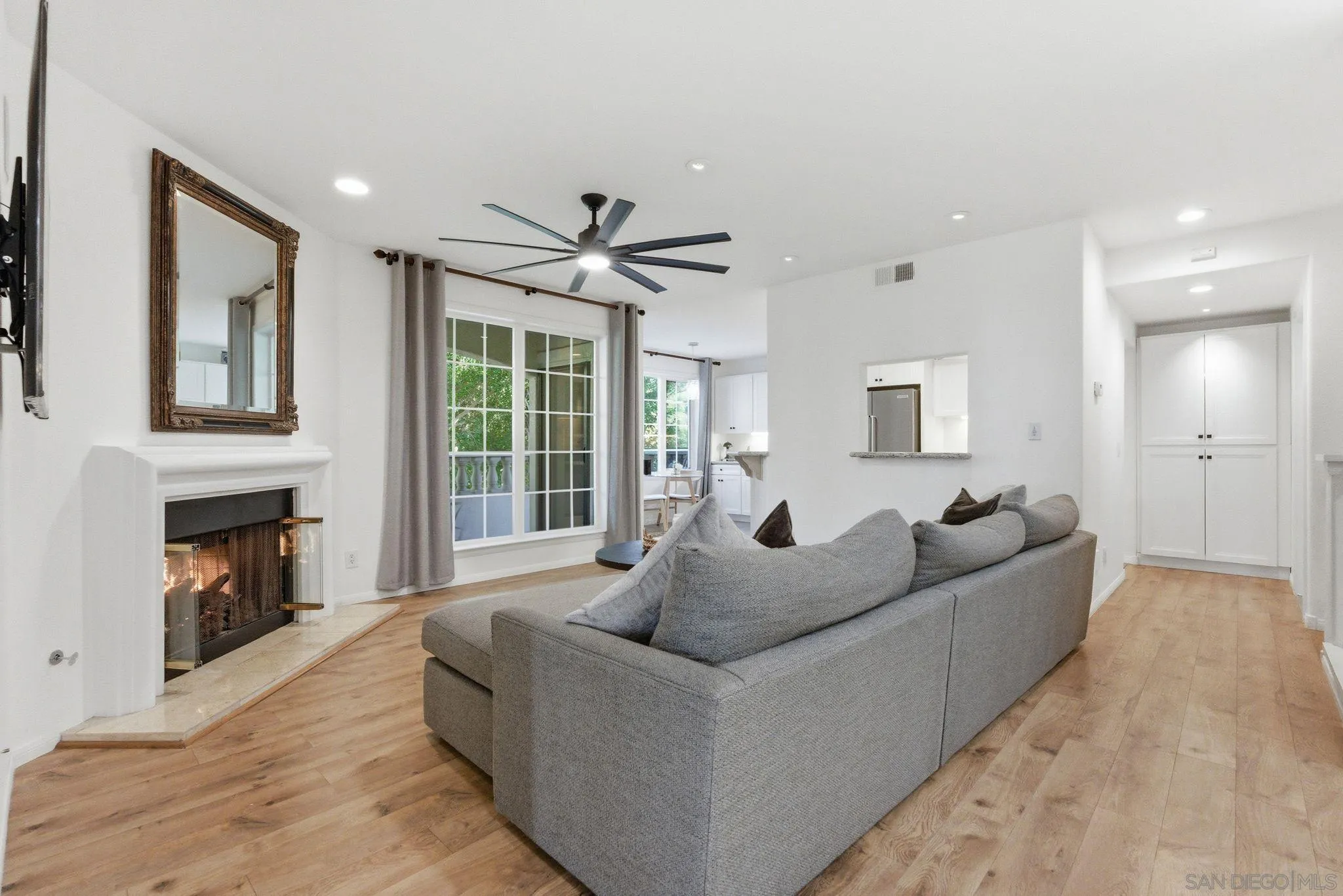 2842 Torrey Pines Road La Jolla, CA 92037 - Photo 7 of 45 a living room with furniture and a fireplace