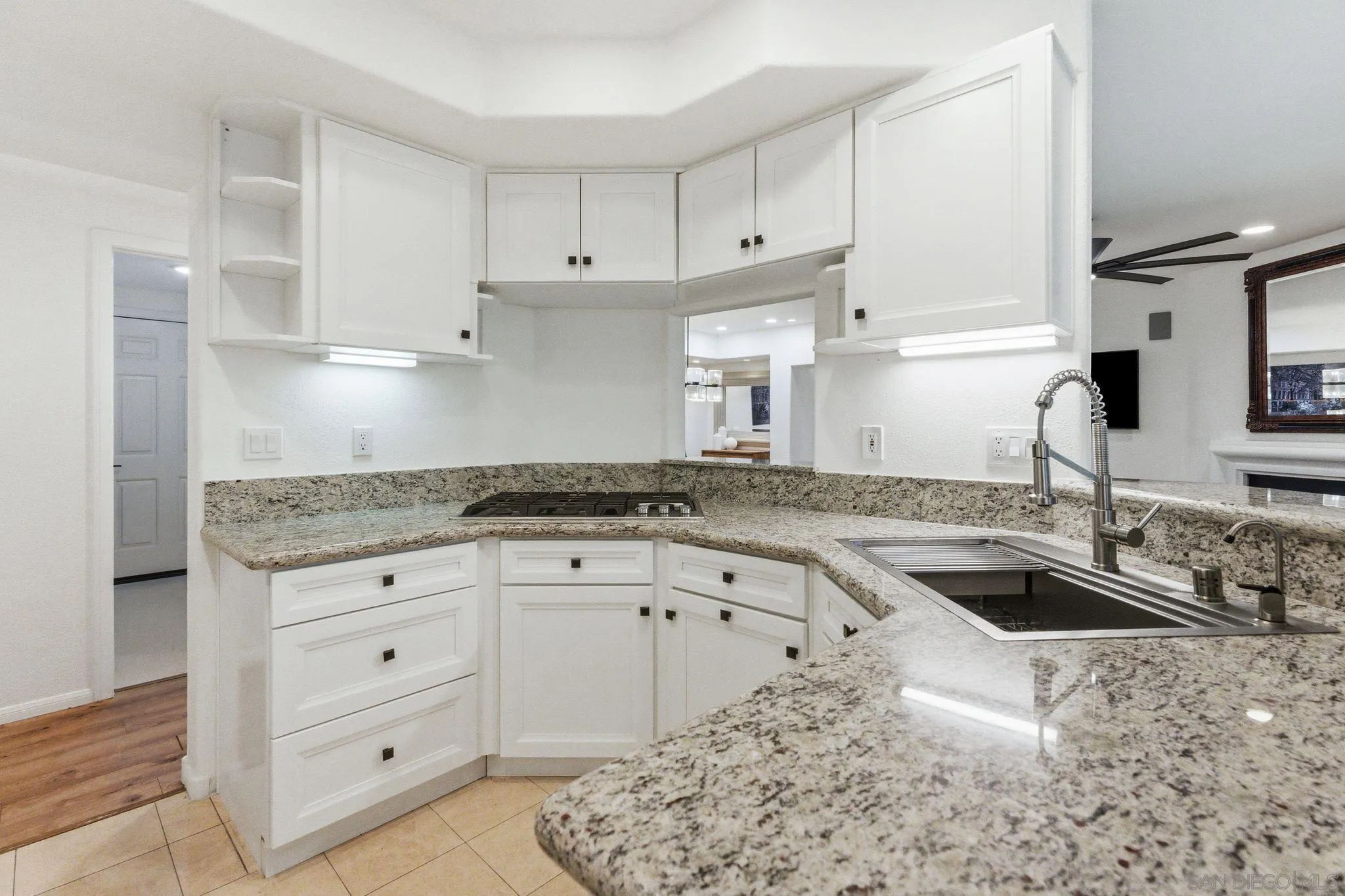 2842 Torrey Pines Road La Jolla, CA 92037 - Photo 8 of 45 a kitchen with granite countertop a sink stove and cabinets
