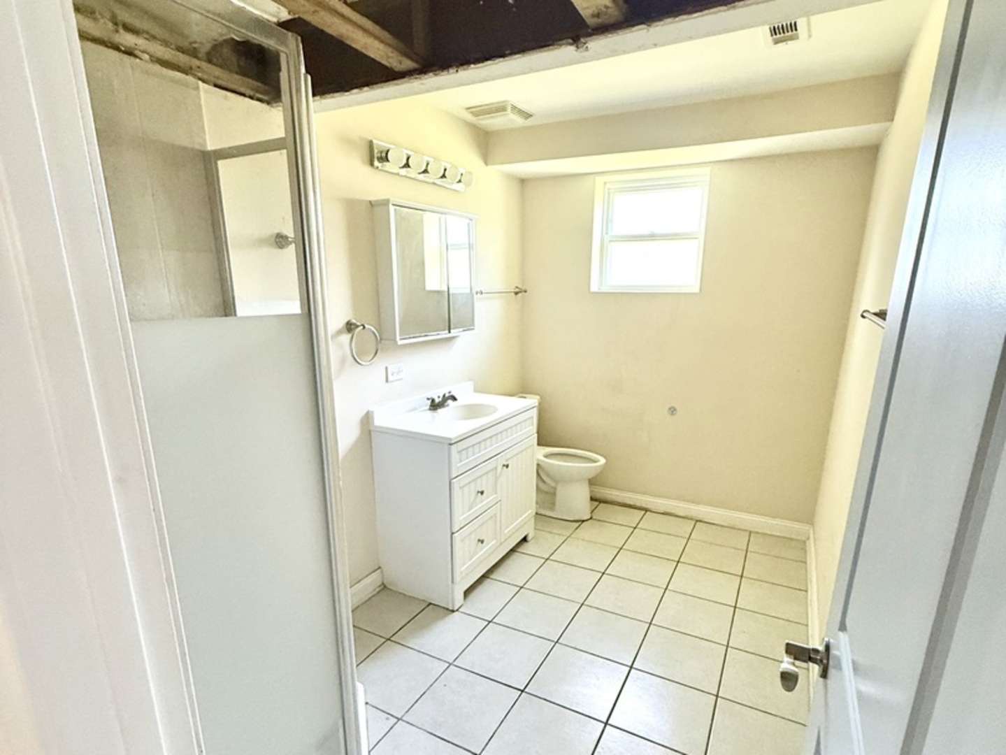 8356 South 78th Avenue Bridgeview, IL 60455 - Photo 30 of 39 a bathroom with a sink a toilet and a mirror