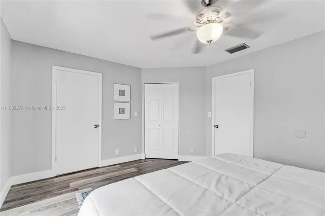 a bathroom with a bathtub toilet and shower