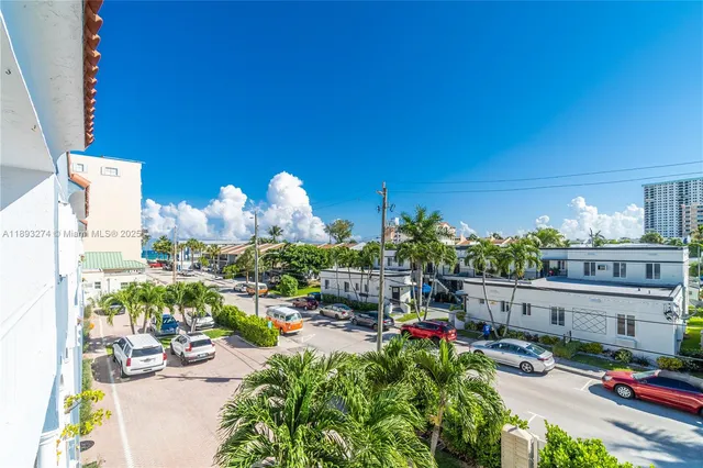 a view of a house with a chairs and table in a patio