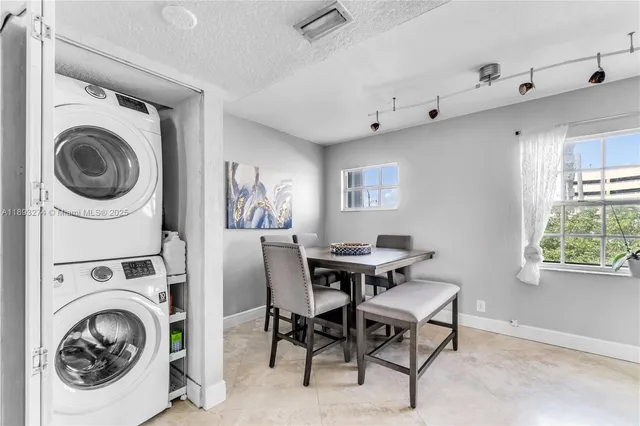 a kitchen with a refrigerator stove and microwave