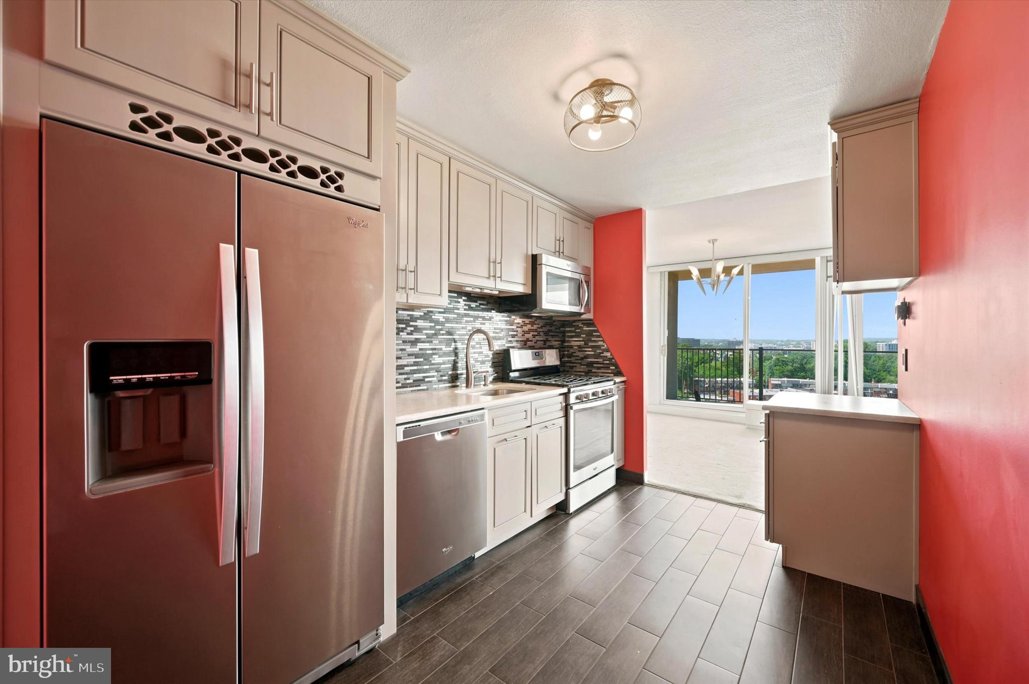 3900 West Ford Road, Unit 15R Philadelphia, PA 19131 - Photo 1 of 19 a kitchen with stainless steel appliances a refrigerator sink and cabinets