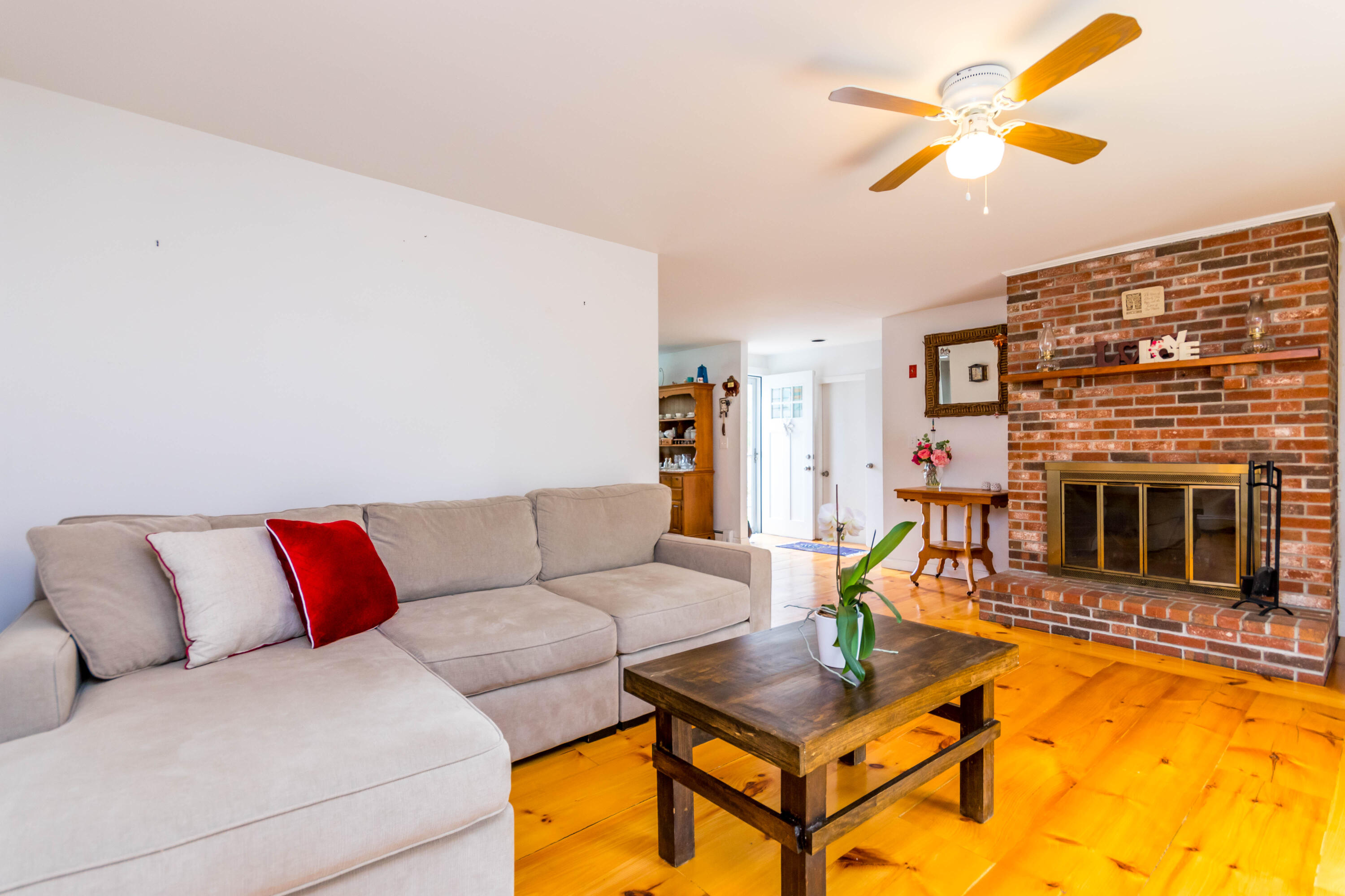 59 North Precinct Road Centerville, MA 02632 - Photo 3 of 30 a living room with furniture and a fireplace