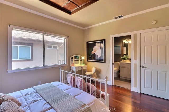 a bedroom with furniture and a window