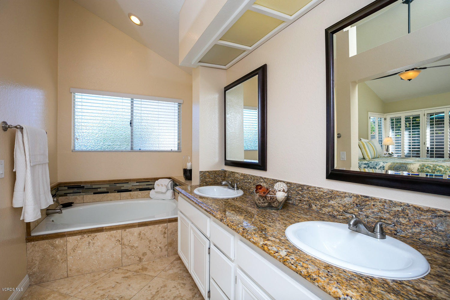 539 Galloping Hill Road Simi Valley, CA 93065 - Photo 16 of 30 a bathroom with a granite countertop sink and a mirror
