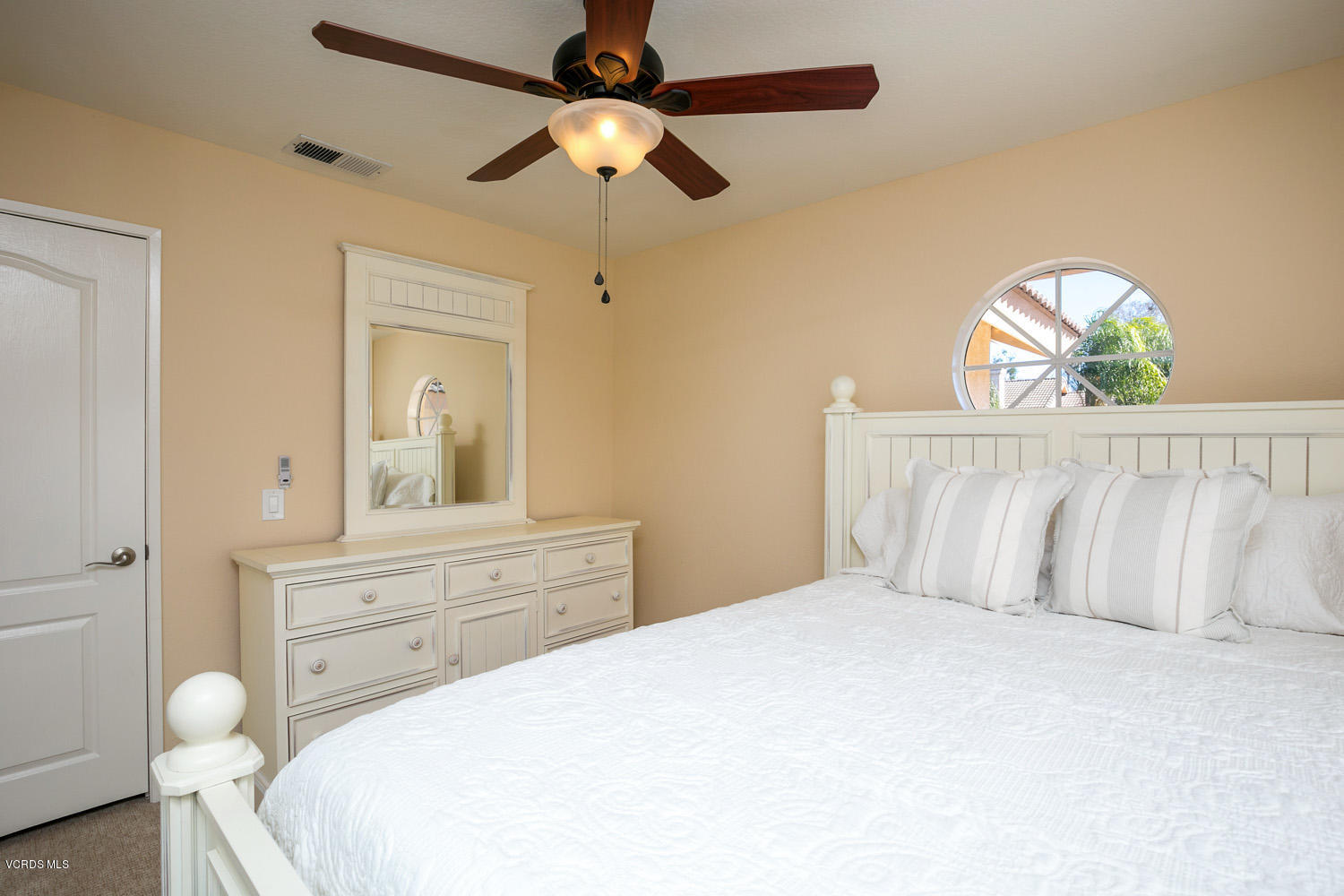539 Galloping Hill Road Simi Valley, CA 93065 - Photo 19 of 30 a bedroom with a bed and a chandelier