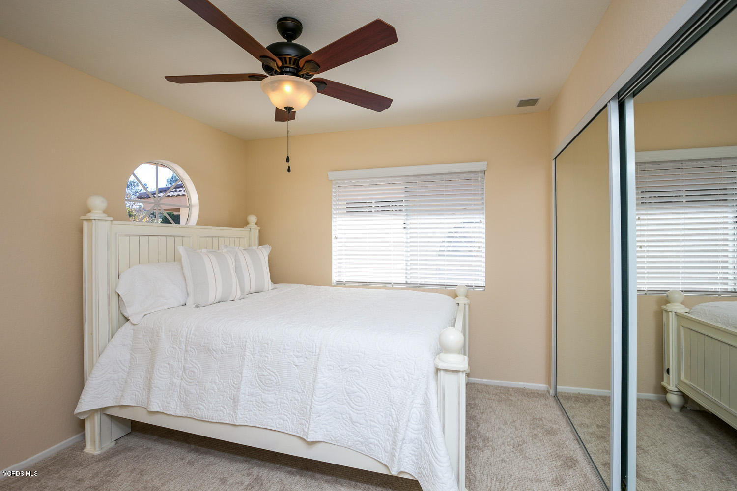539 Galloping Hill Road Simi Valley, CA 93065 - Photo 20 of 30 a bedroom with a bed and a chandelier