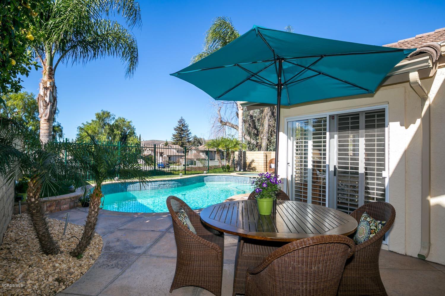 539 Galloping Hill Road Simi Valley, CA 93065 - Photo 25 of 30 a view of an outdoor sitting area with furniture and umbrella